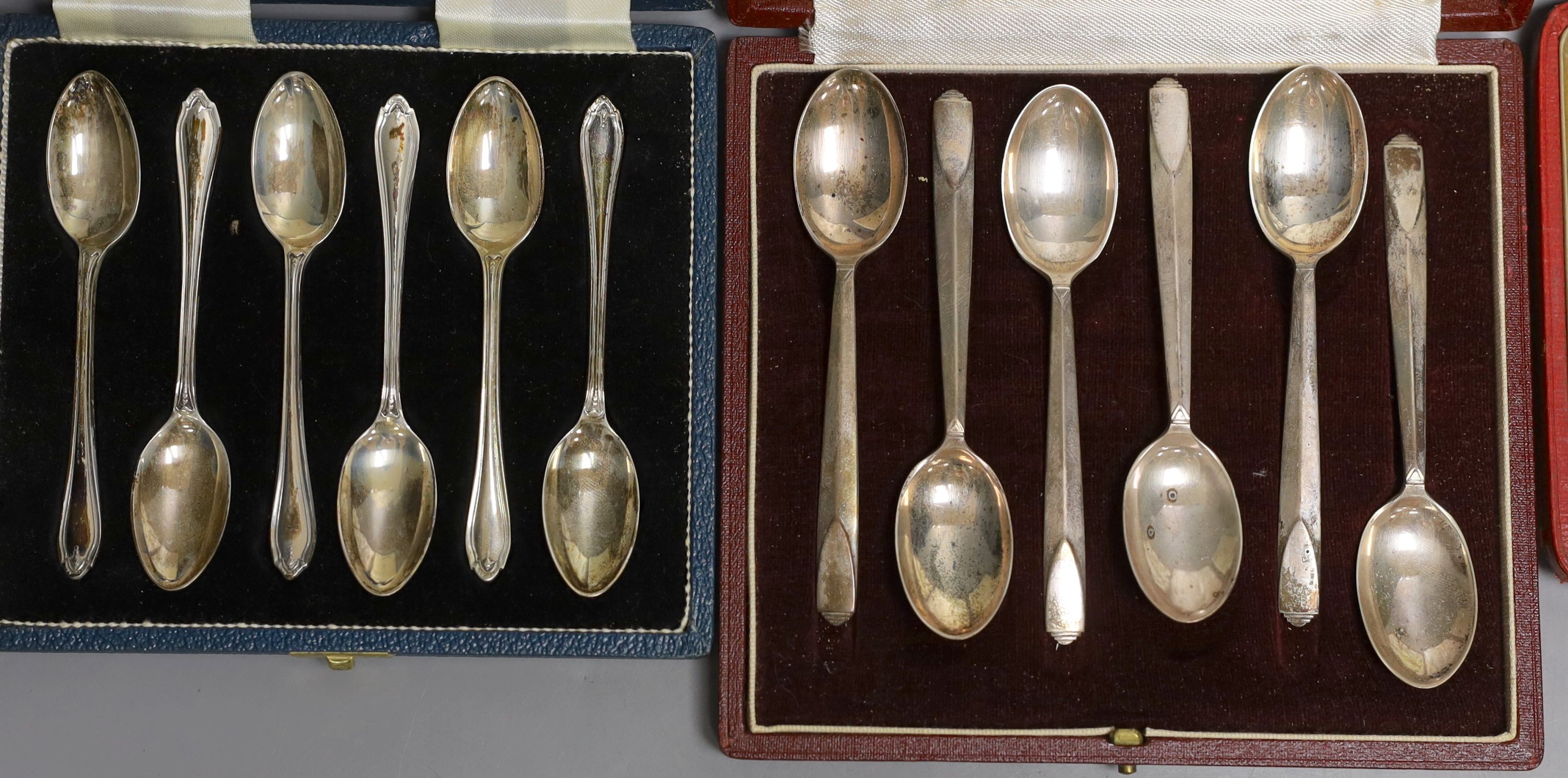 Two cased sets of six silver teaspoons including Art Deco and a cased set of Scandinavian gilt white metal and enamel coffee spoons(a.f.0, a silver sugar caster, pair of silver tongs and a Georgian silver caddy spoon.